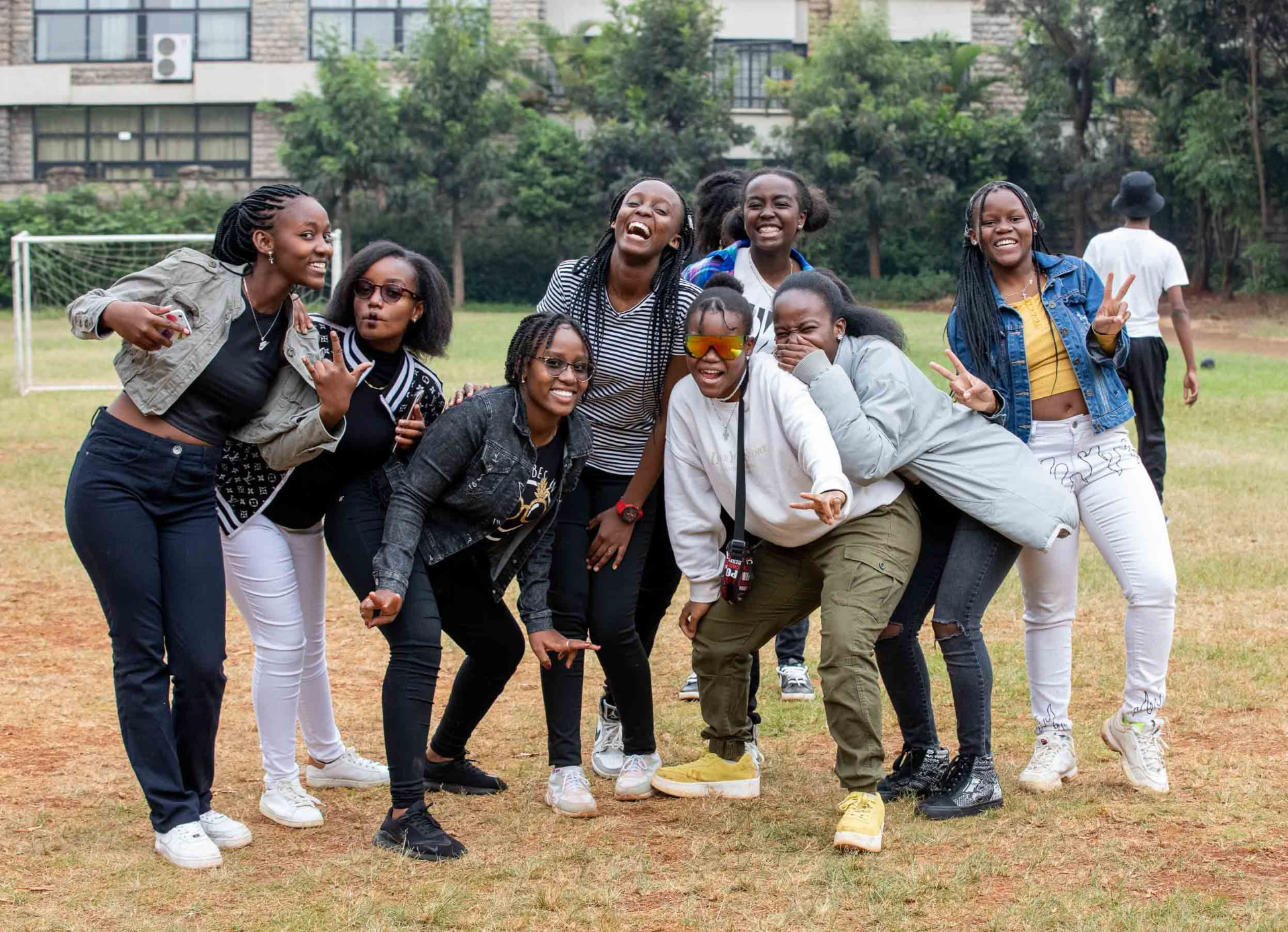 A group of young people laughing together during a campus mental fitness program